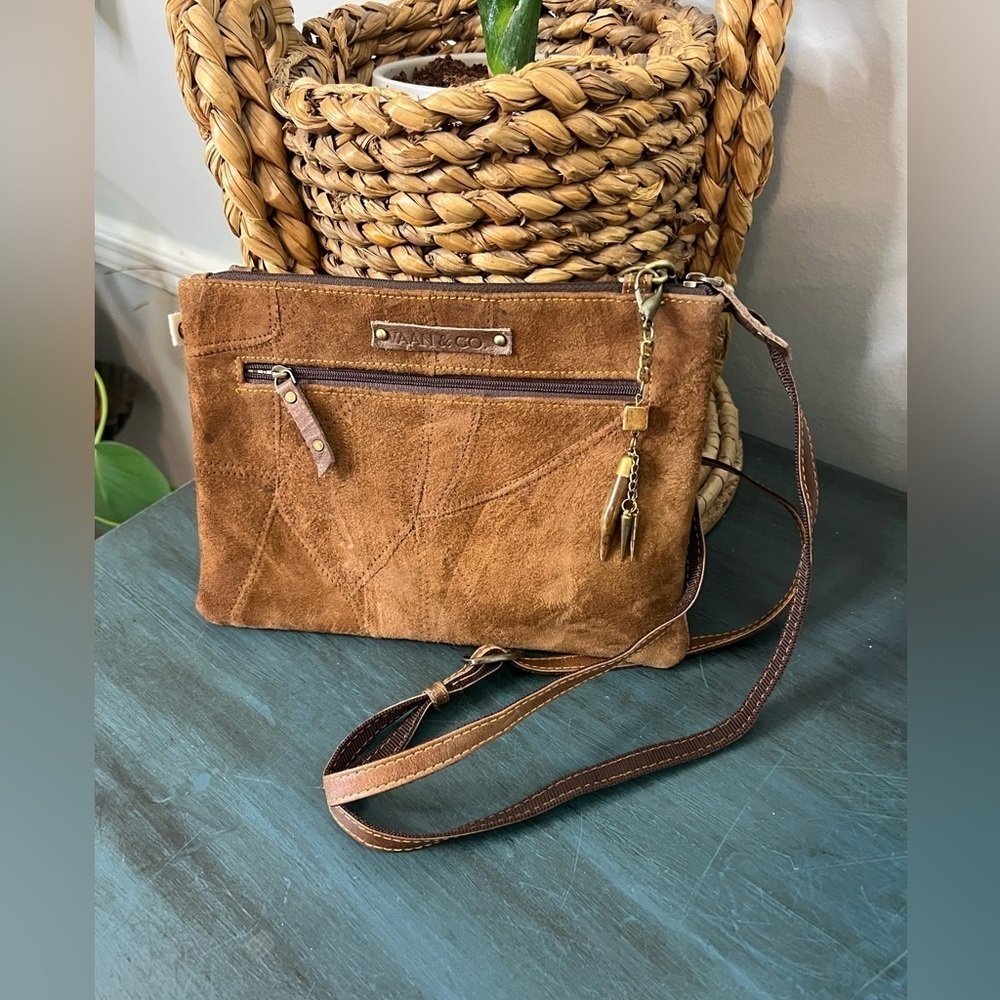 VAAN & CO Leather crossbody with animal print and charms.